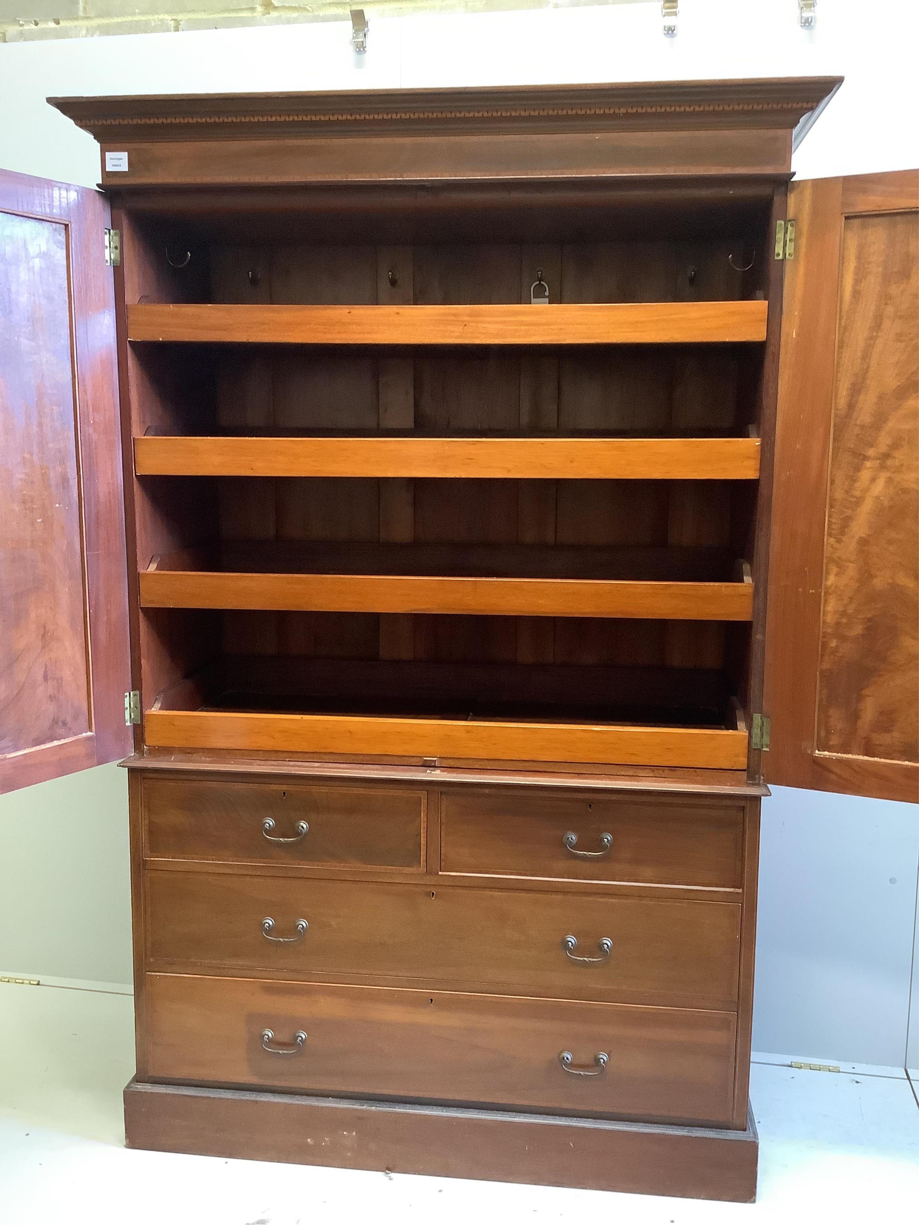 An Edwardian satinwood banded mahogany linen press, width 134cm, depth 56cm, height 200cm. Condition - fair